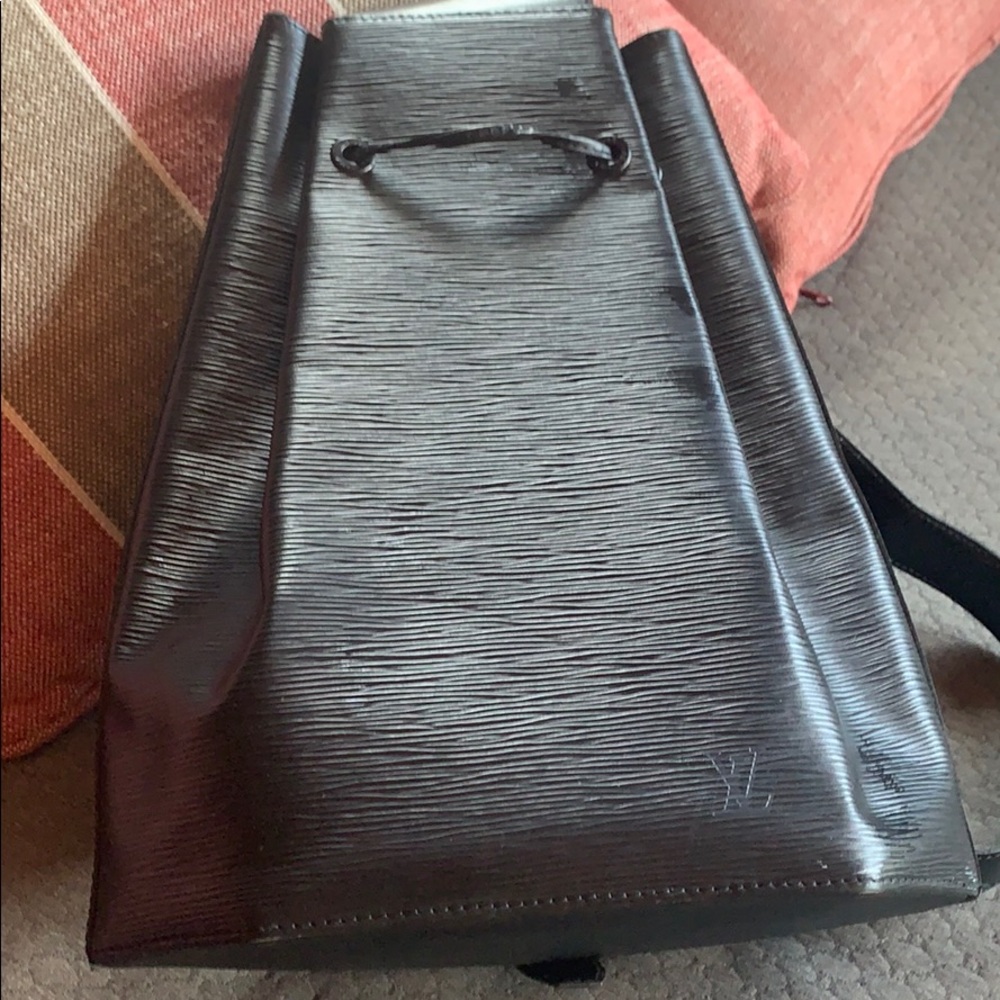 Guaranteed authentic Louis Vuitton swing back